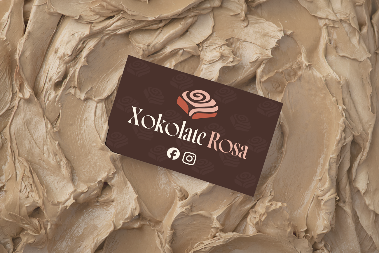 Xokolate Rosa brand in use — business card on textured chocolate-coloured background